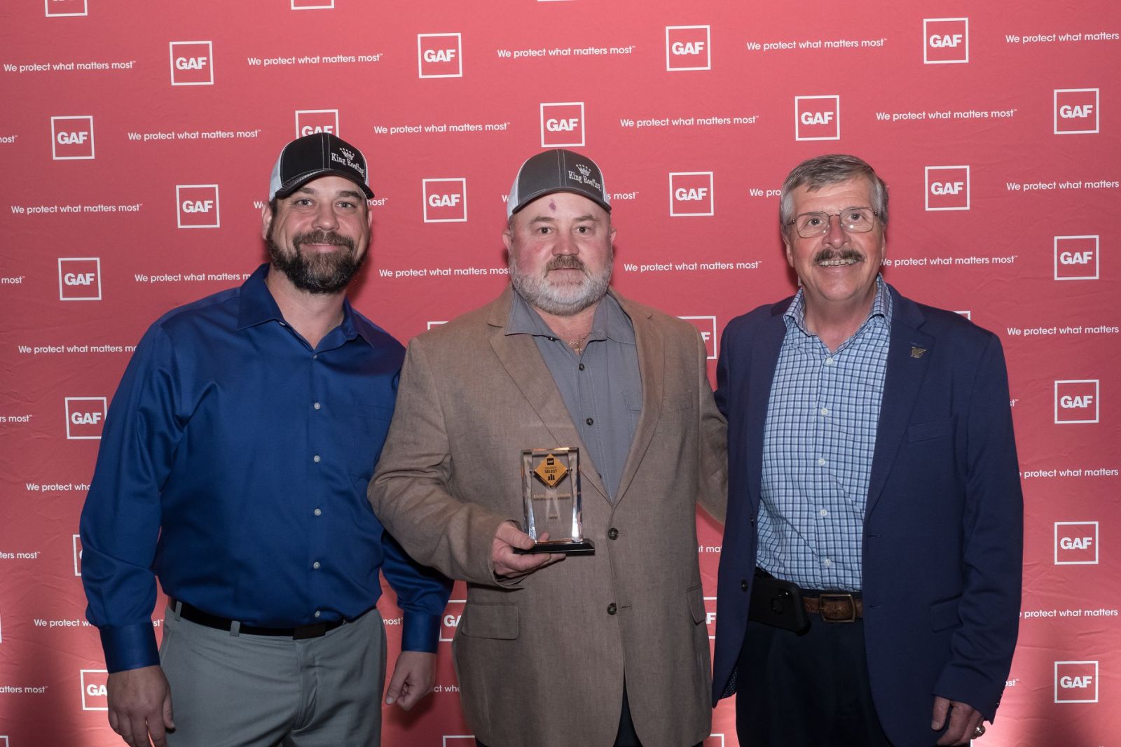 King Roofing General Contracting Images - Owners at GAF Award reception with Master Select Award